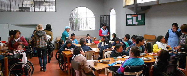 A volunteer teaching in an indigenous school in Quito