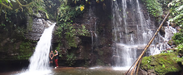 waterfall in teh Amazon jungle near a Shuar community where volunteers can bathe